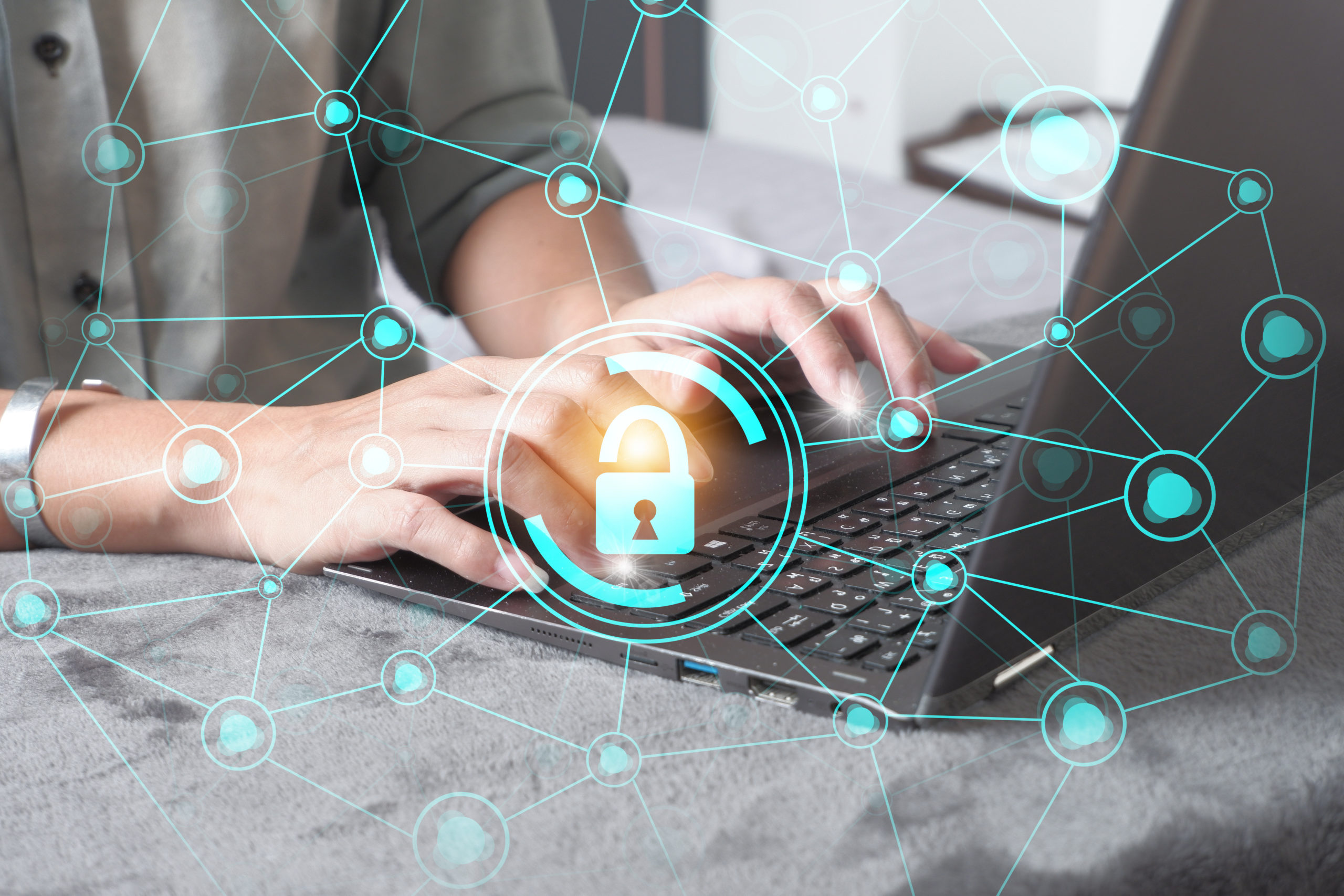 cybersecurity connections overlaid on woman typing on laptop